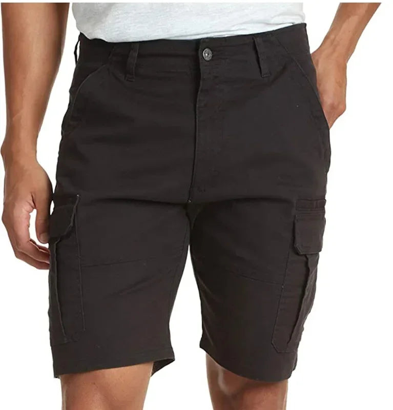 Black cargo shorts worn by a person on a white background