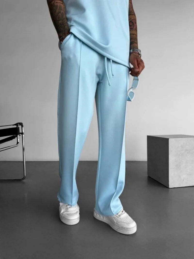 Men’s casual solid-color pants with elastic waist, drawstring closure, and side pockets L blue 