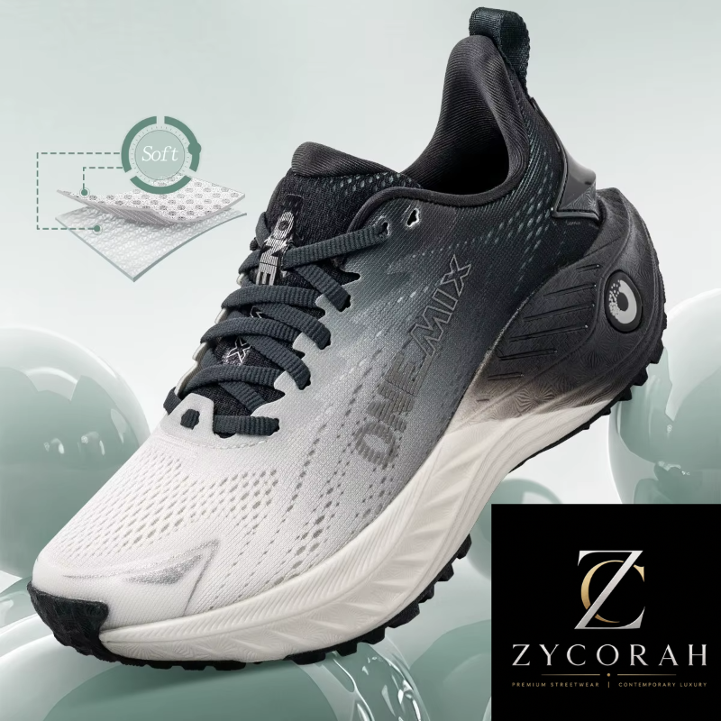 A Zycorah OneMix athletic sneaker shown at a three-quarter angle. The shoe features a white and dark gray gradient mesh upper, black laces, and a thick white midsole with black outsole details.
