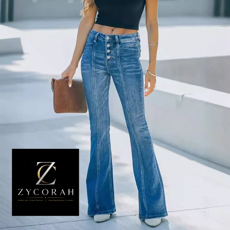 A model wearing high-waisted blue flare jeans with a button fly, styled with a black crop top and white heels, holding a brown clutch bag. A ZYCORAH brand logo is displayed in the bottom-left corner.