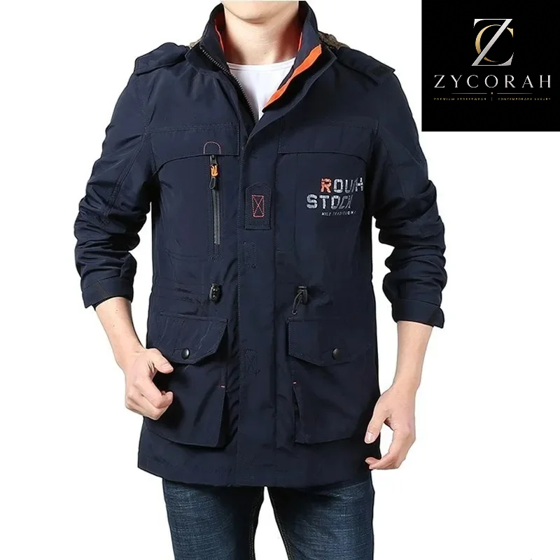 A man wearing a dark navy blue utility jacket with multiple pockets, zippered details, and a visible ZYCORAH brand logo on the chest, set against a plain white background.
