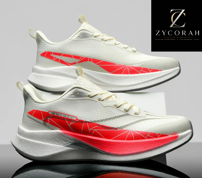 A pair of white athletic sneakers with bold red geometric side accents, displayed on a reflective surface against a gray studio background. A black ZYCORAH brand logo is visible in the top right, and a promotional banner at the bottom reads 'GOOD QUALITY +50 UP TO % off'.