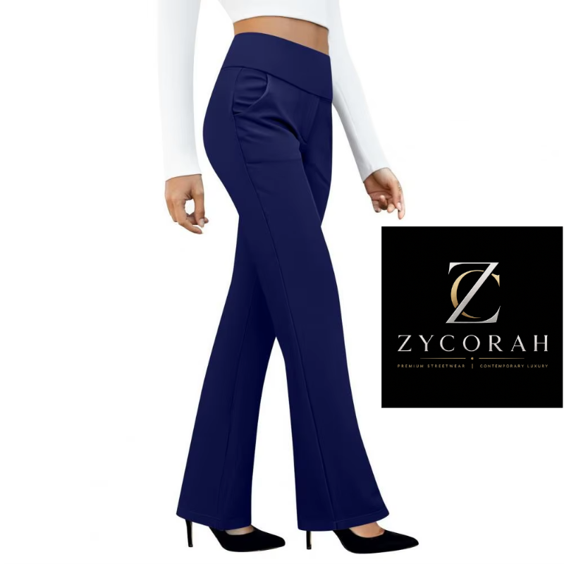 A model is shown from the waist down wearing high-waisted, wide-leg navy blue pants with a side pocket, paired with a white long-sleeve crop top and black heels. A black brand logo overlay for 'Zycorah' is visible on the right side of the image.