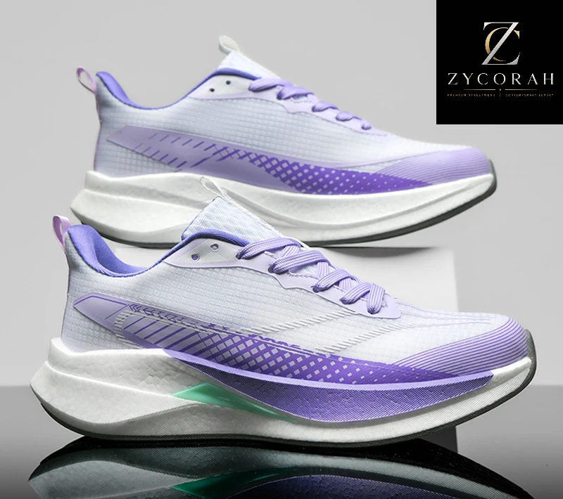 A pair of athletic sneakers in white and purple, shown from the side and rear angles on a reflective gray surface. The brand logo 'ZYCORAH' is visible in the top right corner, and a promotional banner 'GOOD QUALITY +50% UP TO off' is at the bottom.