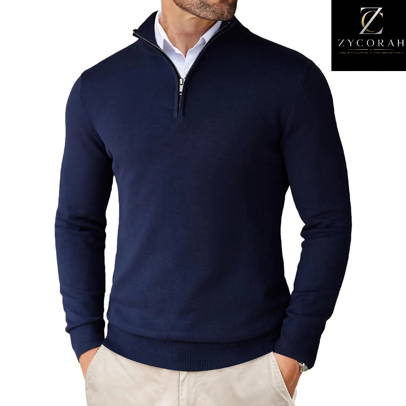 A man wearing a navy blue quarter-zip knit sweater over a white collared shirt and beige pants, shown from the neck down on a white background with a ZYCORAH logo in the top right corner.